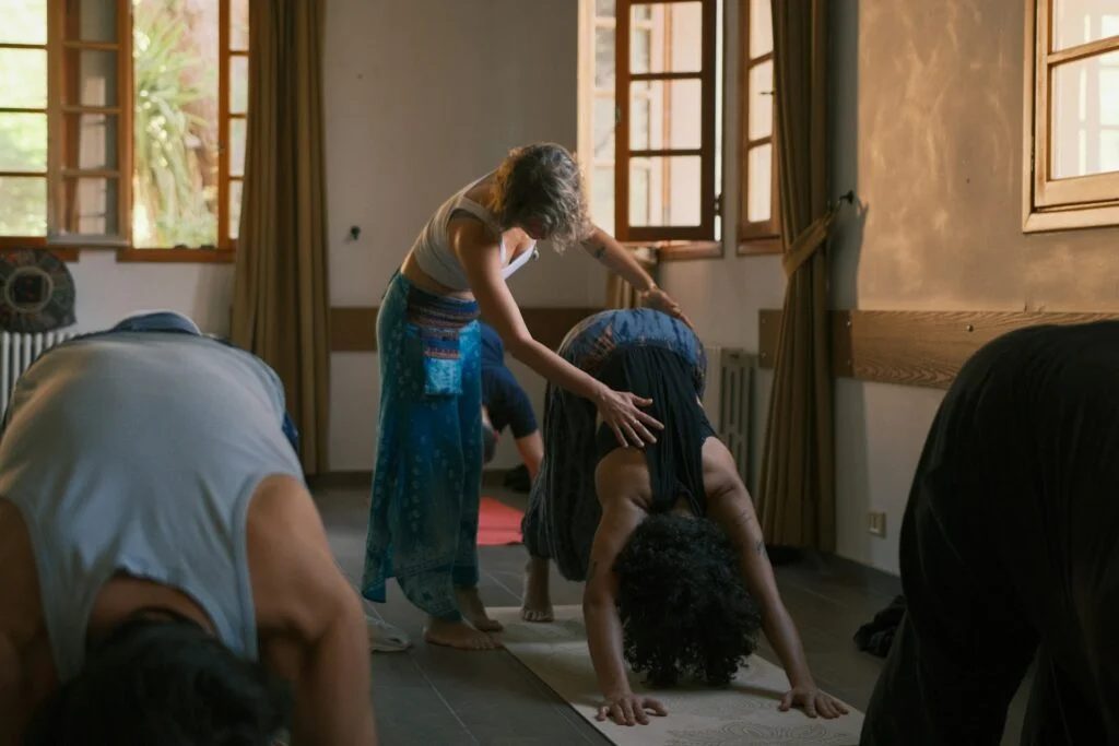 Man and woman doing upward-facing dog yoga pose