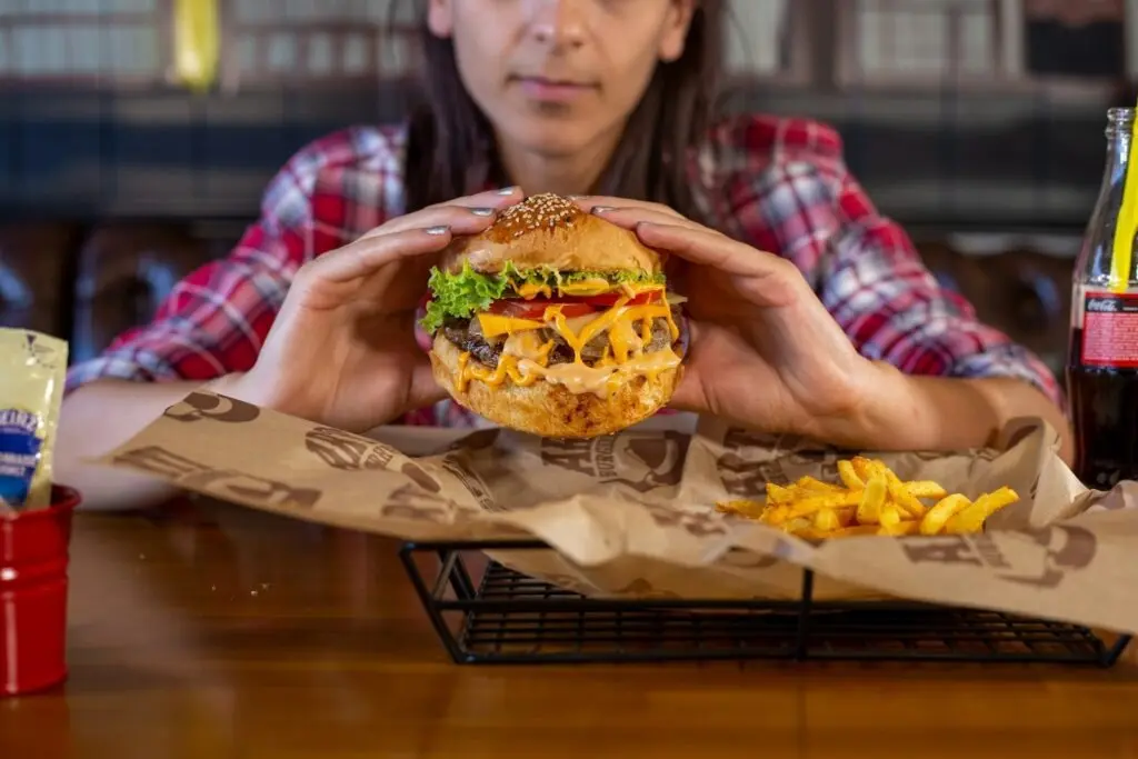 Woman holding a burger
