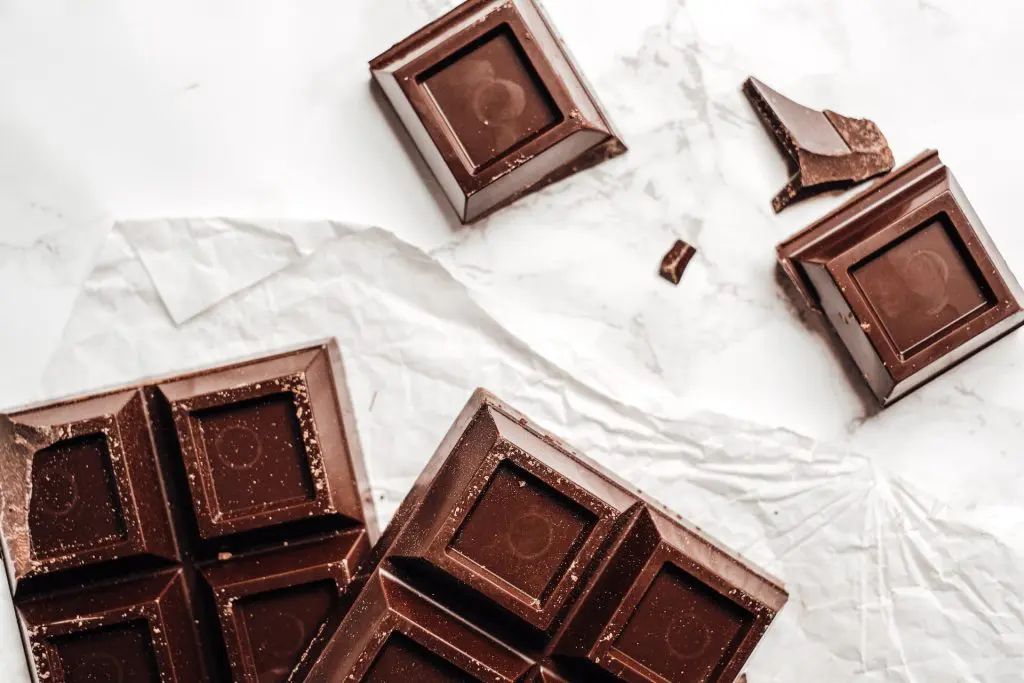 a bar of chocolate with a few pieces broken off