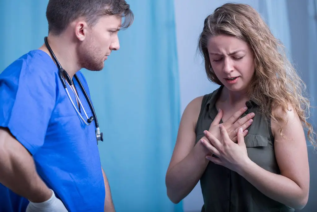 A woman talking to a doctor