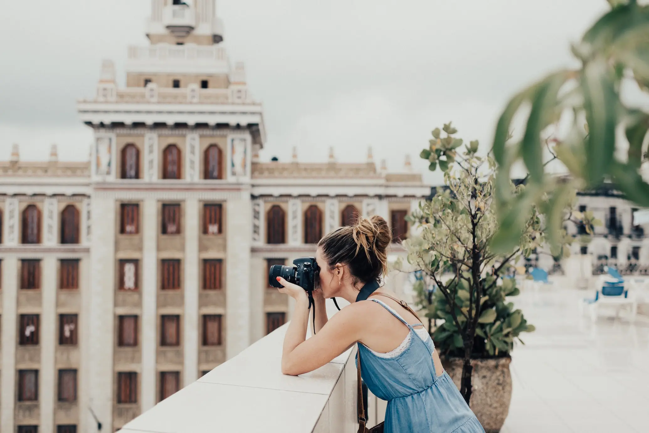 woman taking a photo during her solo travel