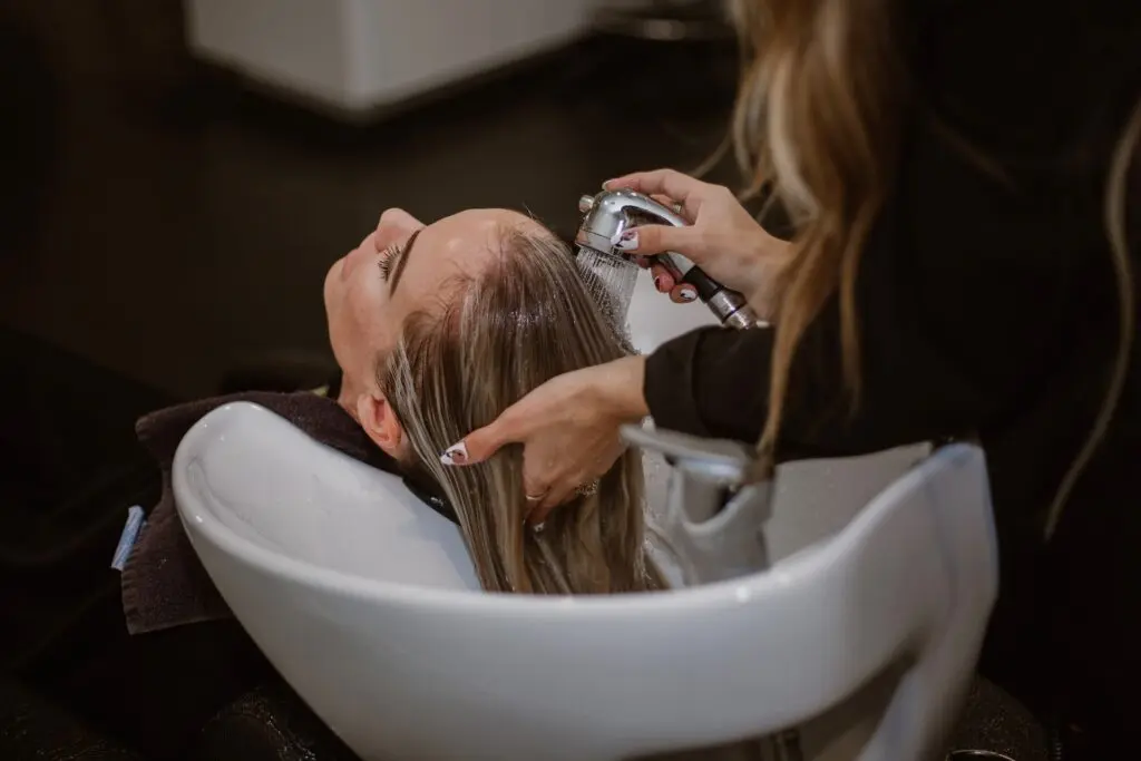 Woman getting hair washed