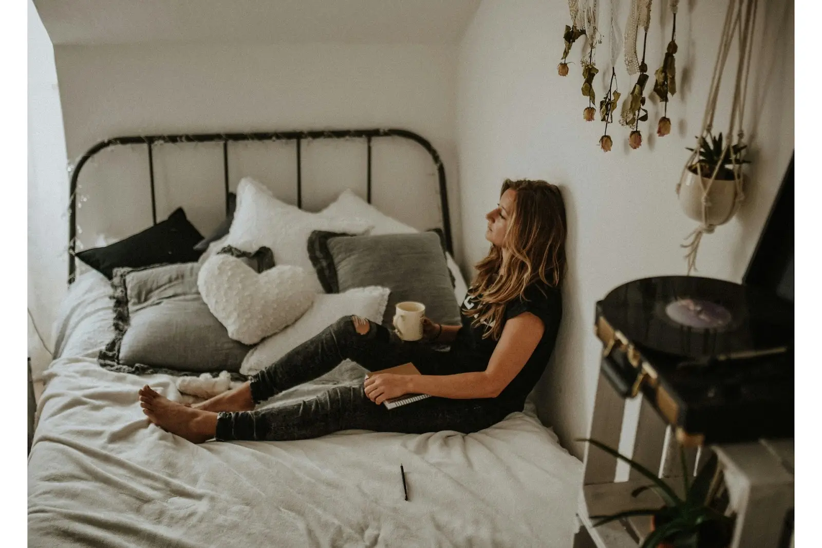 a sad person on a bed with coffee