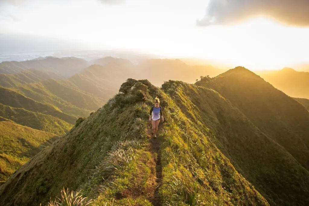 Woman walking on a mountain trail
