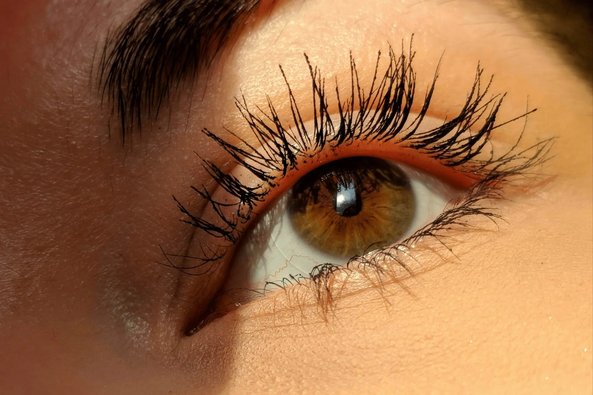 How to Get Mascara Out of Clothes - an image of an eye with mascara