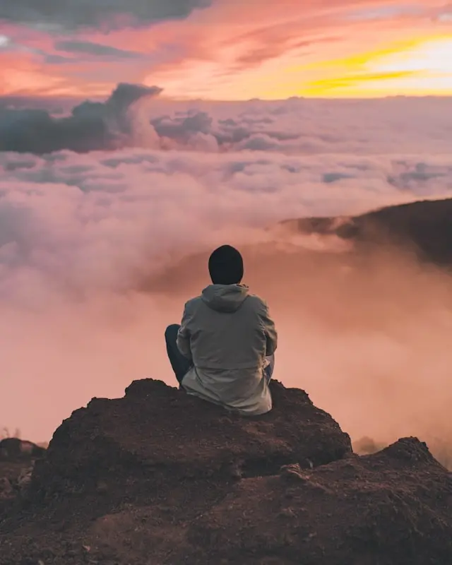 A man meditating on a cliff
Photo by Ian Stauffer on Unsplash