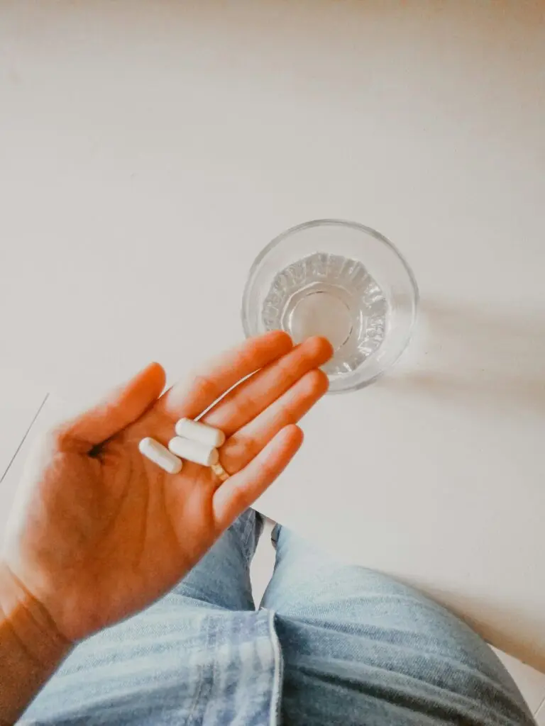 Three supplements in an outstretched hand