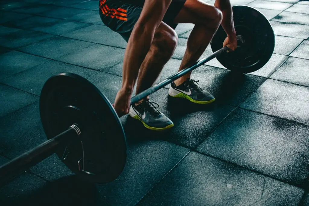 A man lifting weights in a gym