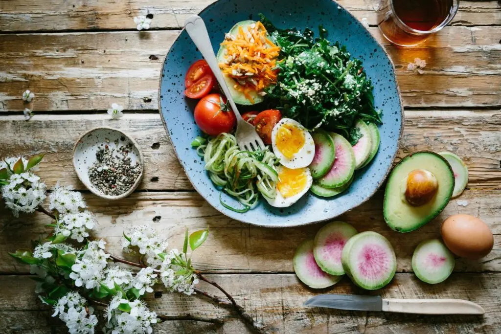 A healthy and colorful meal served on a blue plate.