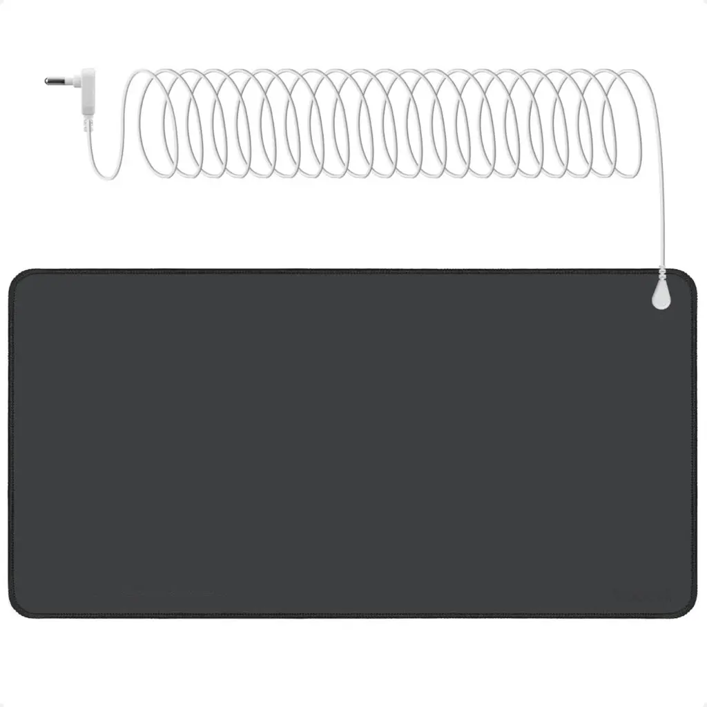 A black grounding mat with a white electrical cord that coils against a white background.
