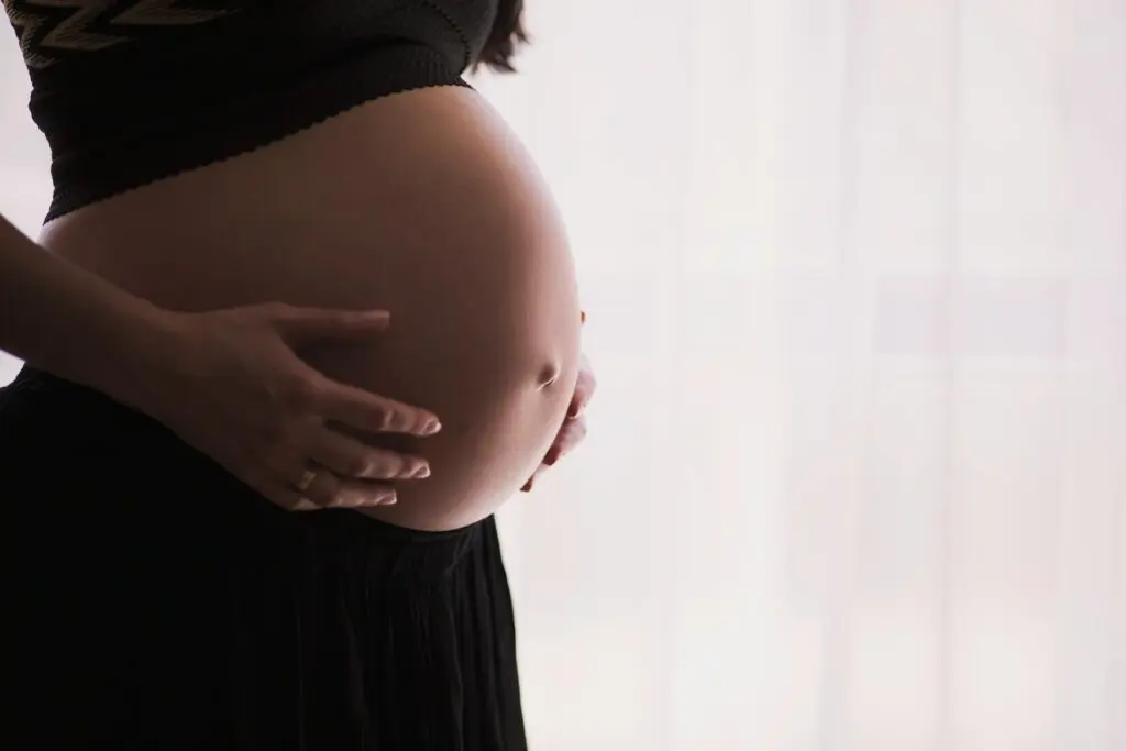 Holding Pregnant Belly