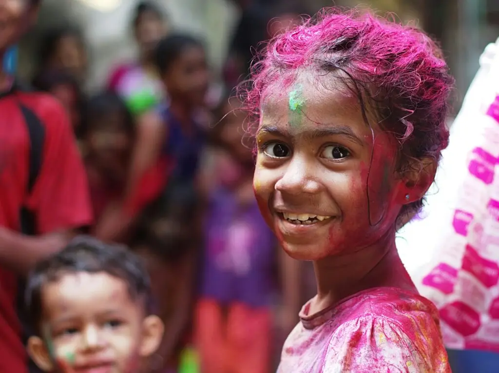 young girl with temporary hair color for kids in pink shades
