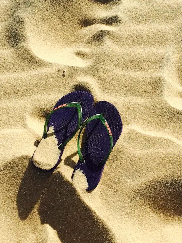 A pair of flip-flops on the beach