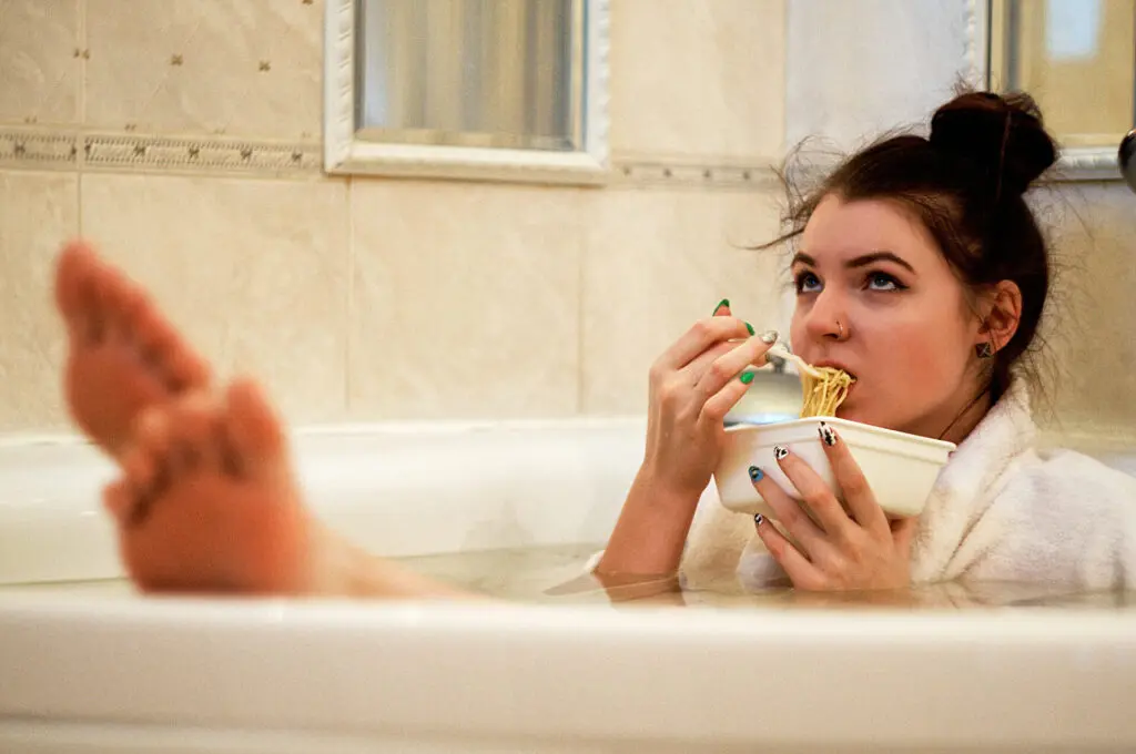 person eating in the bath