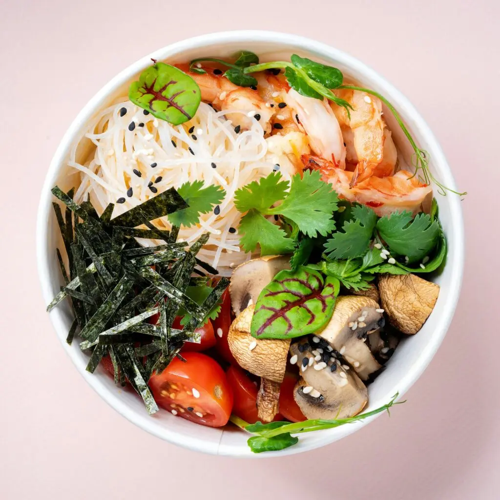 A bowl filled with carbs, vegetables, proteins and fiber