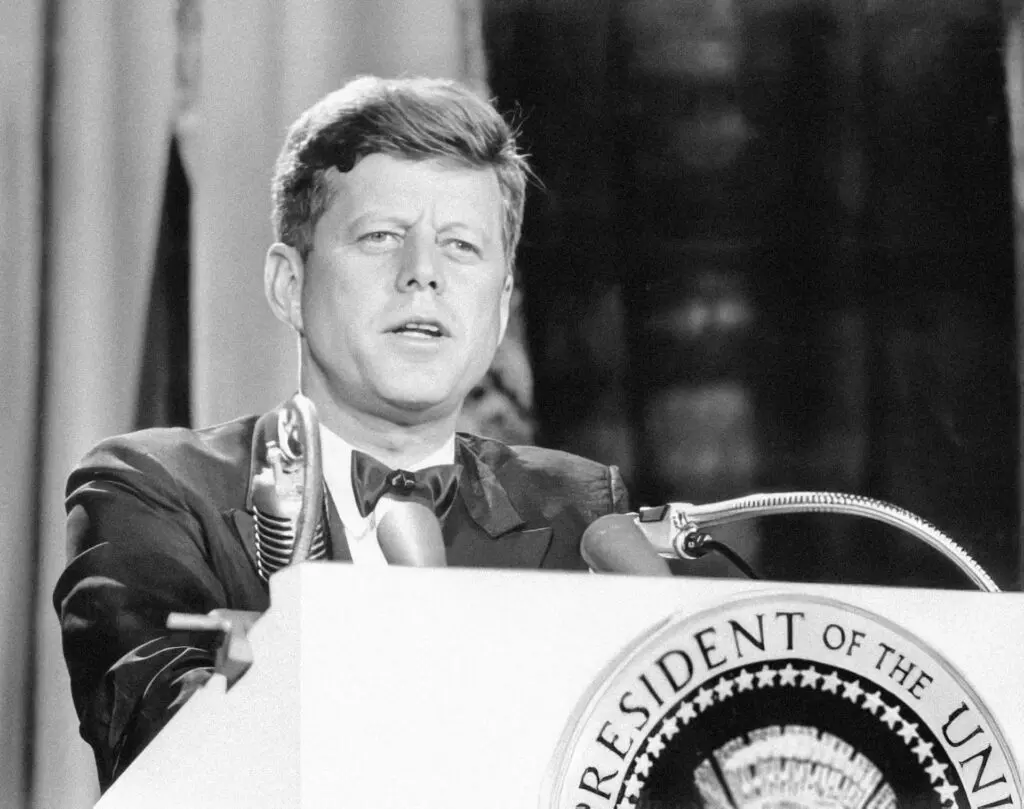A black and white photo of John F. Kennedy giving a speech at a podium, since he's one of the famous people who had ADHD.