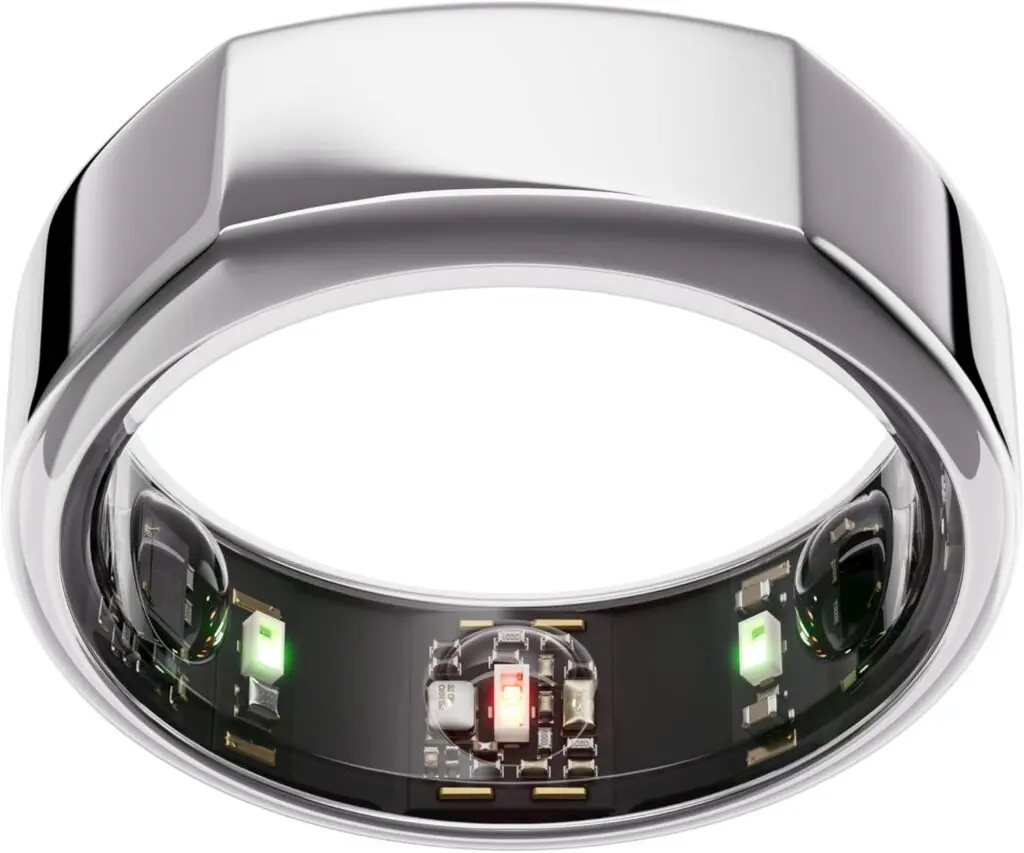 An Oura ring, the 3rd generation, sits against a white background. It's silver with bent edges.
