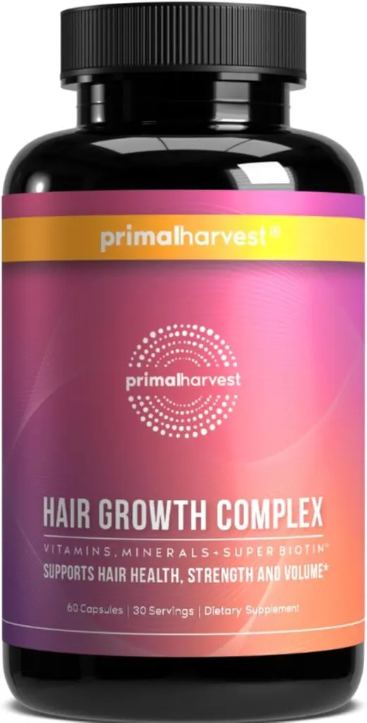 A bottle of Primal Harvest Hair Growth Complex supplements sits against a white background