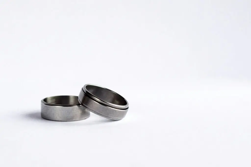 Two silver rings sit on top of each other against a white background.