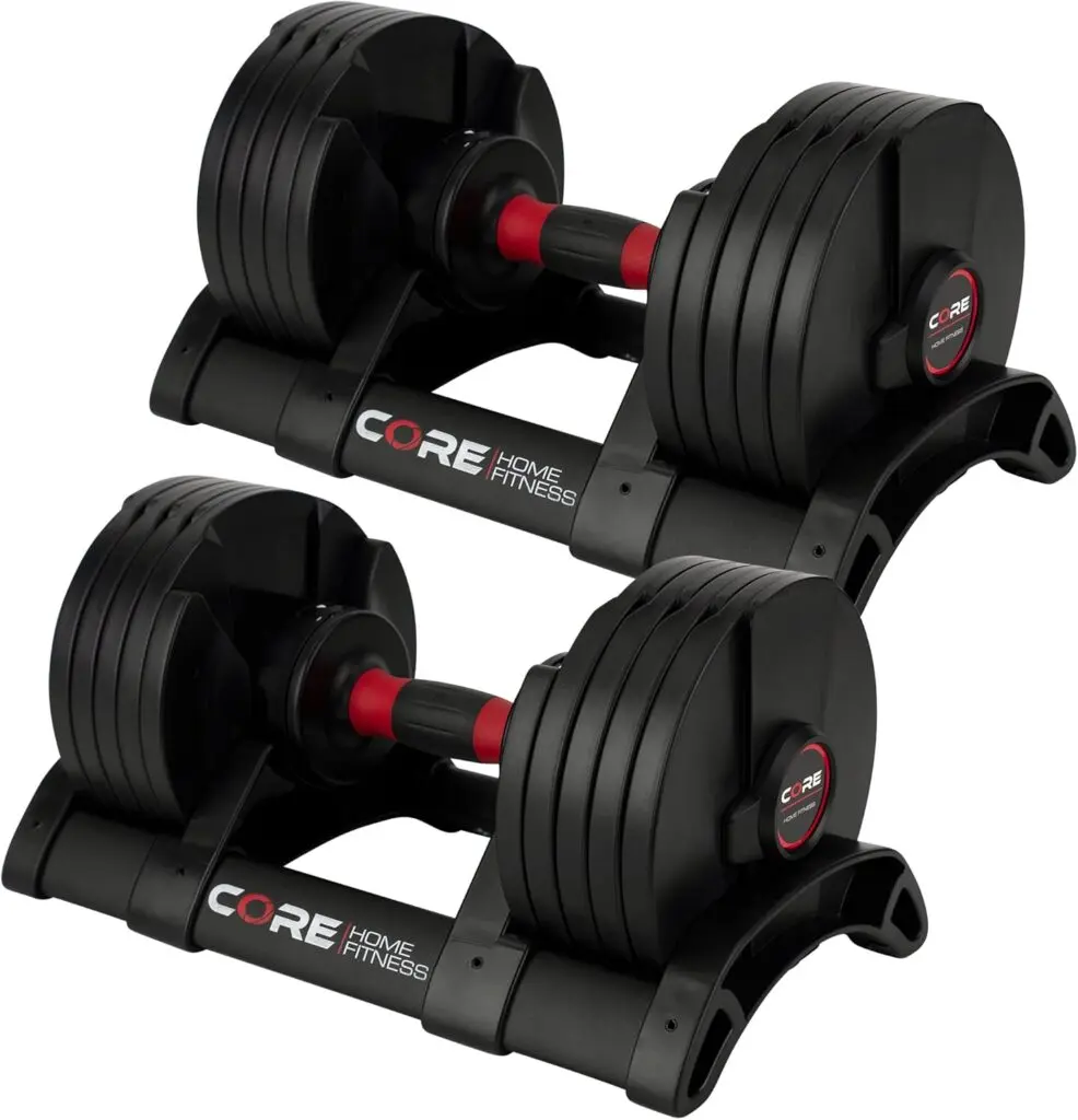 A set of black dumbbells sit on individual stands. They have red handles and removable black plates.