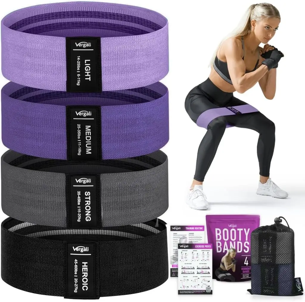 A set of four fabric resistance bands that are black, gray, dark purple and light purple stack against a white background. A blonde woman squats during a workout in the top right corner while wearing the light purple band. The bands' purple packaging, black mesh bag and two-page instruction pamphlet sit in the bottom right corner.
