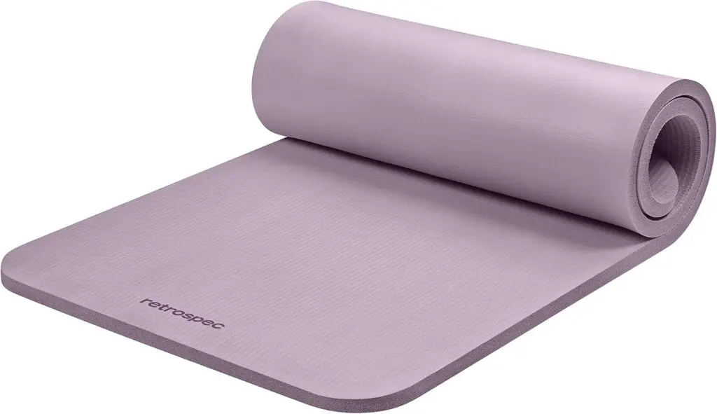 A light purple Retrospec yoga mat sits against a white background. It's halfway curled up onto itself.