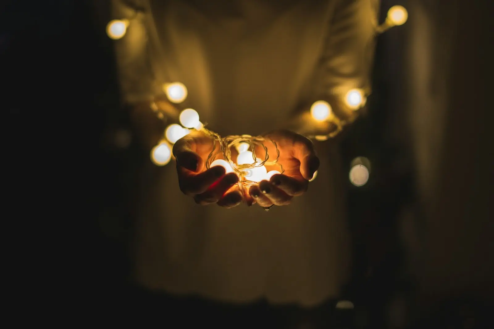 holding christmas lights