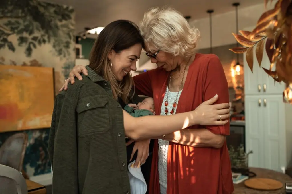 A woman hugging her older mom