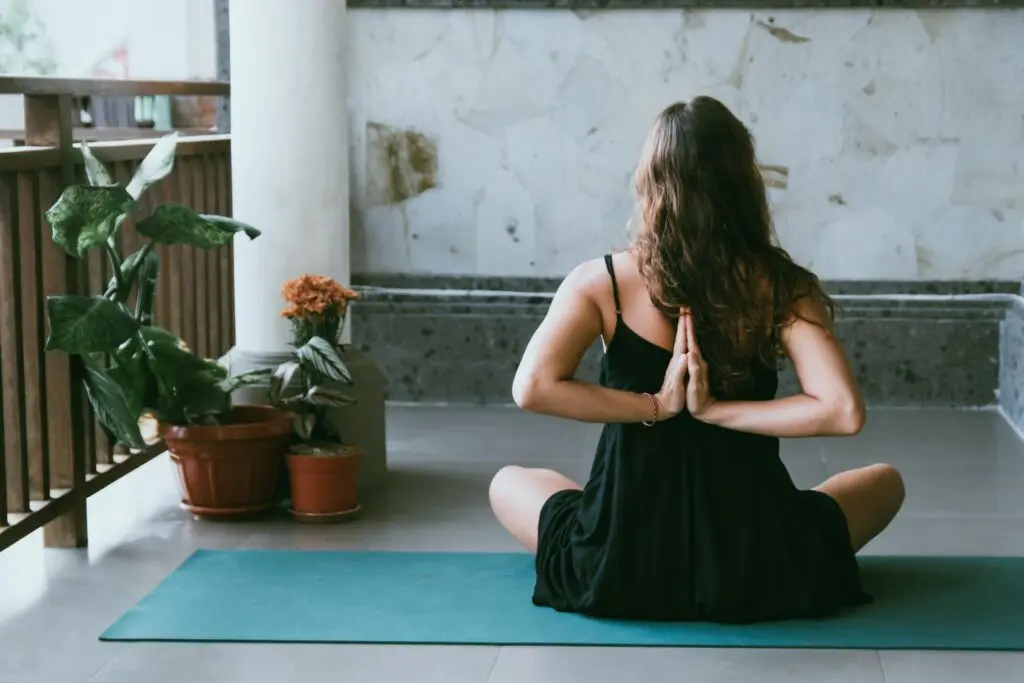 A woman doing yoga for better posture.