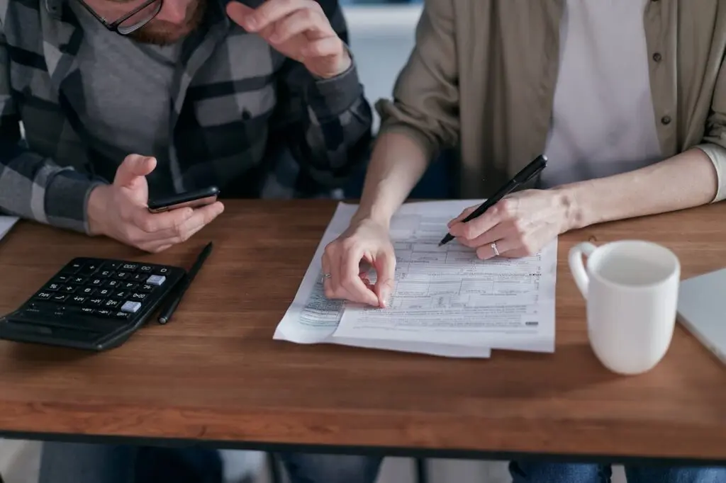 A couple discussing paperwork concerning financial matters