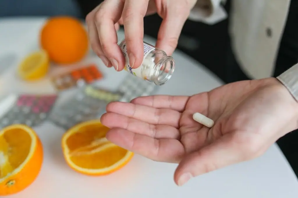 A person taking a pill