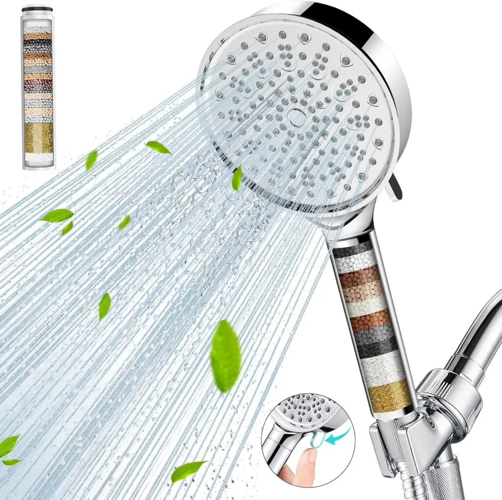 Cobbe's six-spray shower head water filter sits against a white background. Water streams from the shower head and green pointed leaves are in the spray. The multi-colored filter is revealed within the handle.