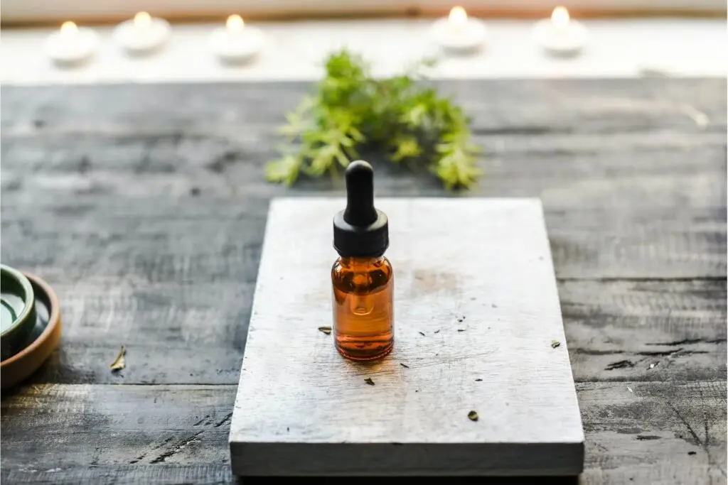 A castor oil bottle on a wooden slab