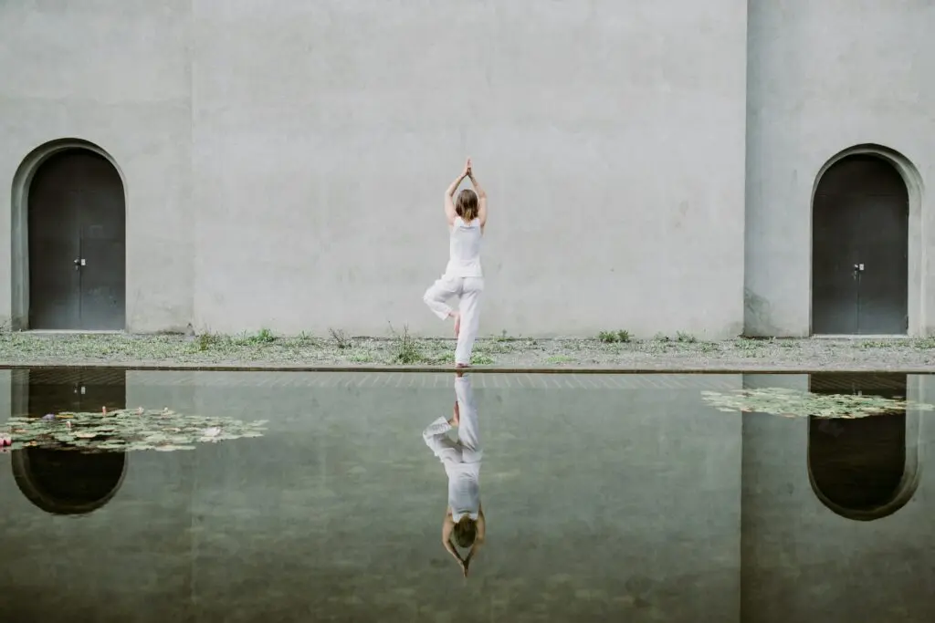 Woman doing yoga pose on one foot