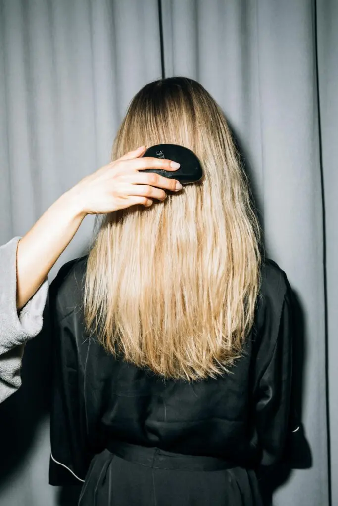 Beautiful long, blonde hair being brushed