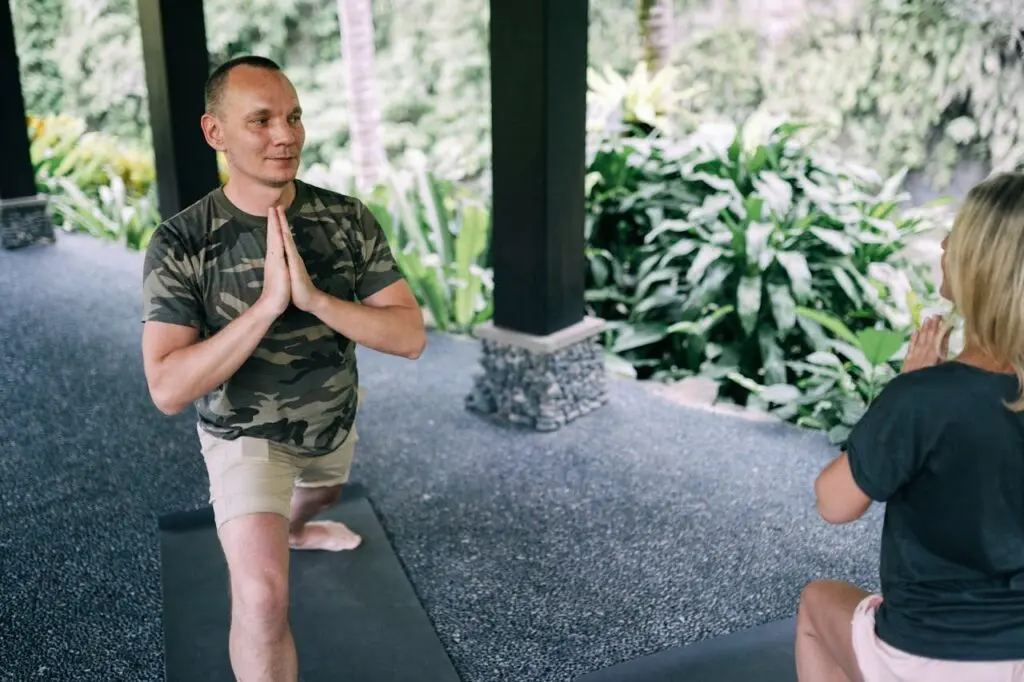 Two people ding breathwork exercises