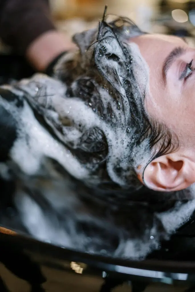 A woman getting her hair washed