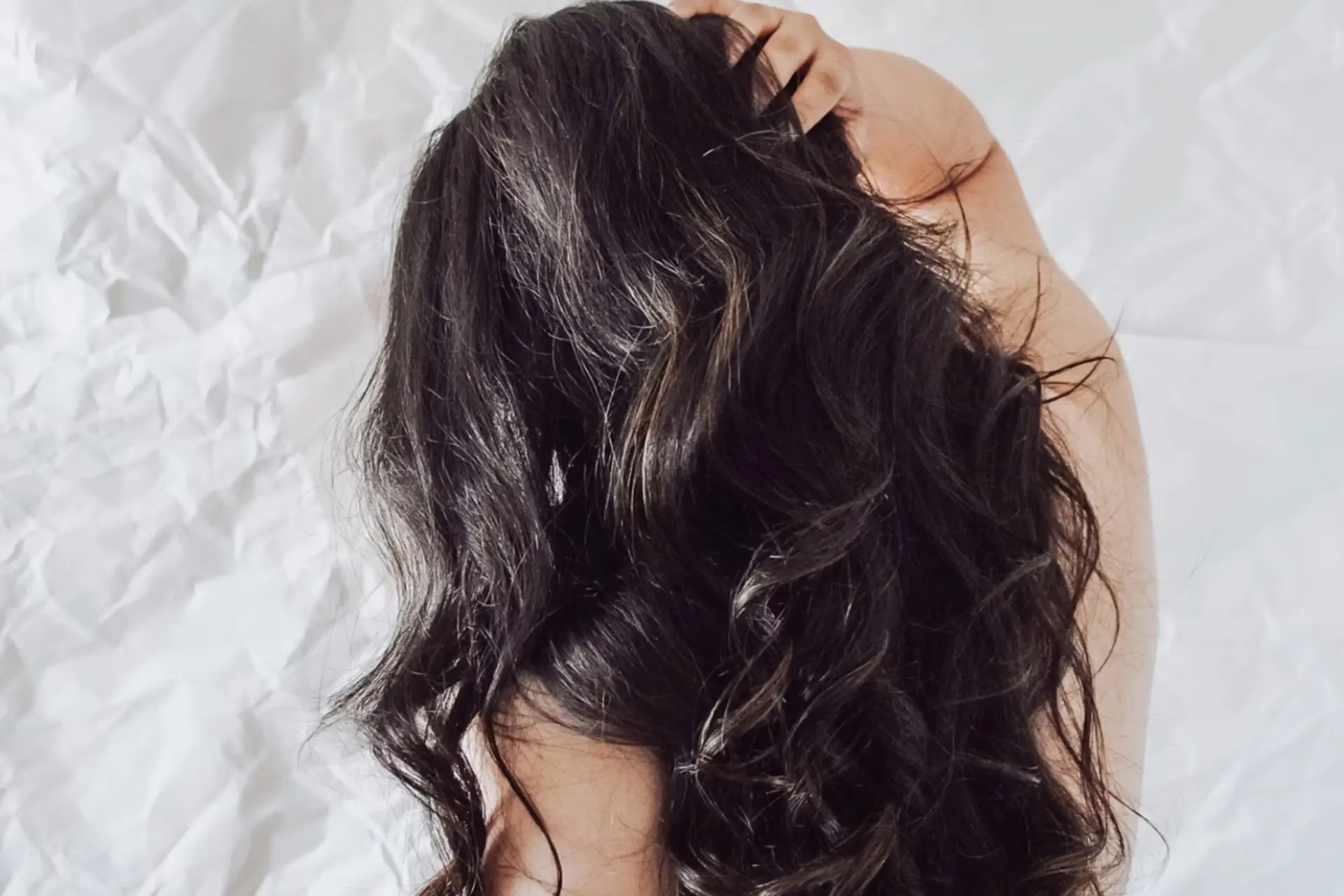 girl scratching scalp