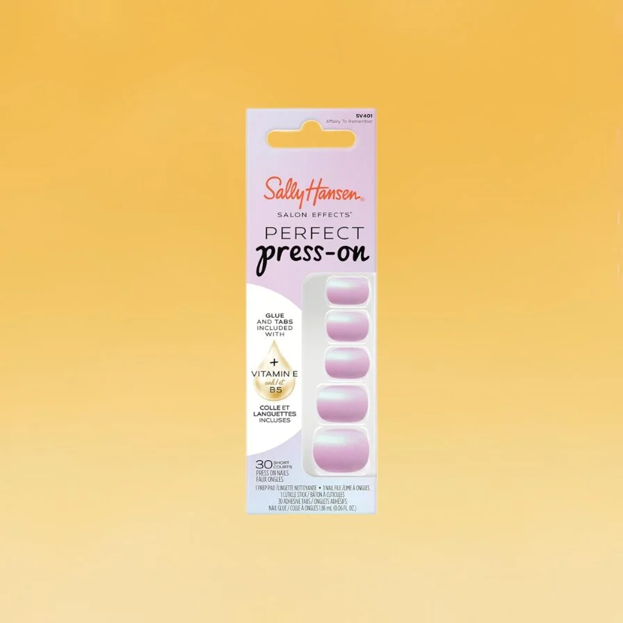 A pink container of Sally Hansen Perfect Press On Nails sits against the yellow Body+Mind background. It's one of the best drugstore beauty products.