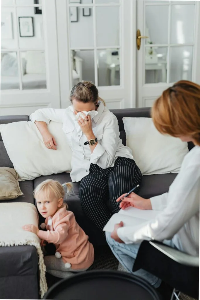 Crying Woman on Sofa and Child