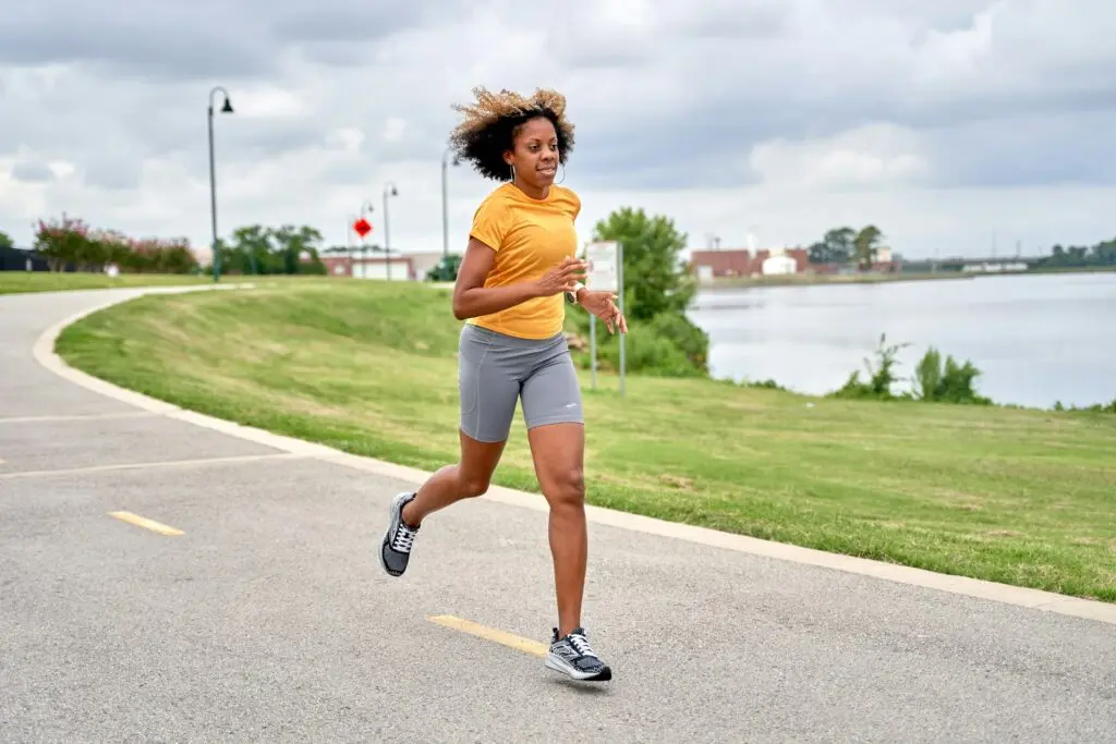 Woman running on a road