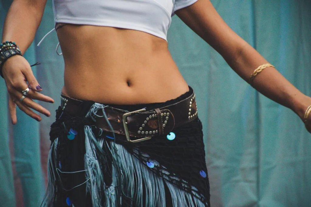 Person Wearing White Cropped-top and Black Bottoms