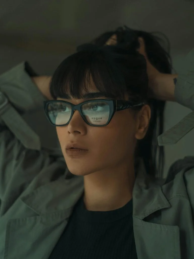 Stylish Woman Posing in Glasses Indoors