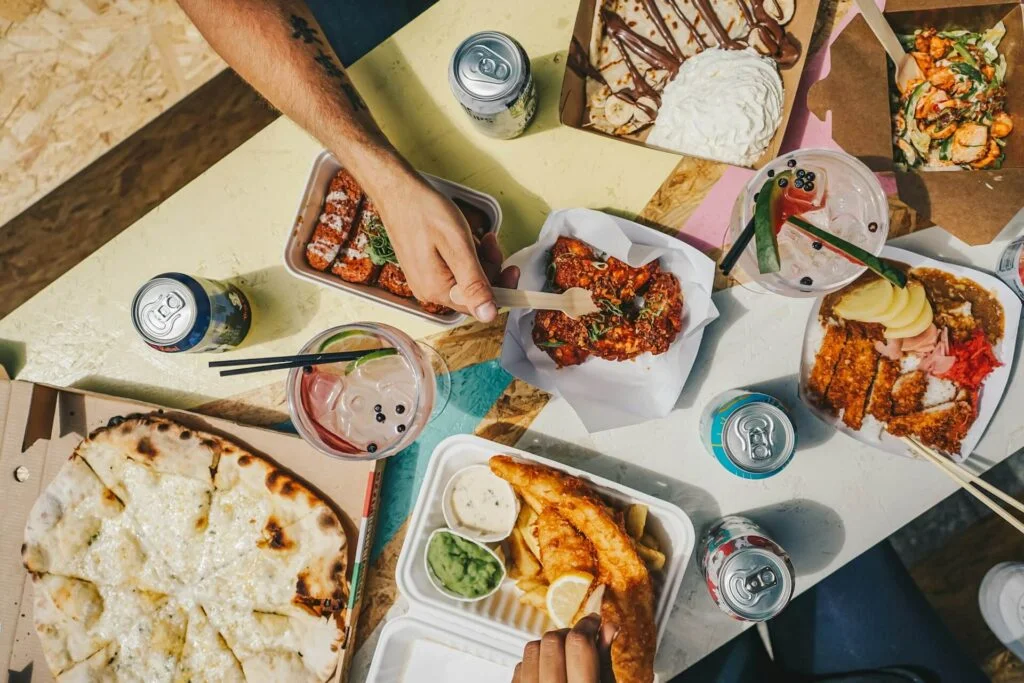 People sitting around a table eating food
