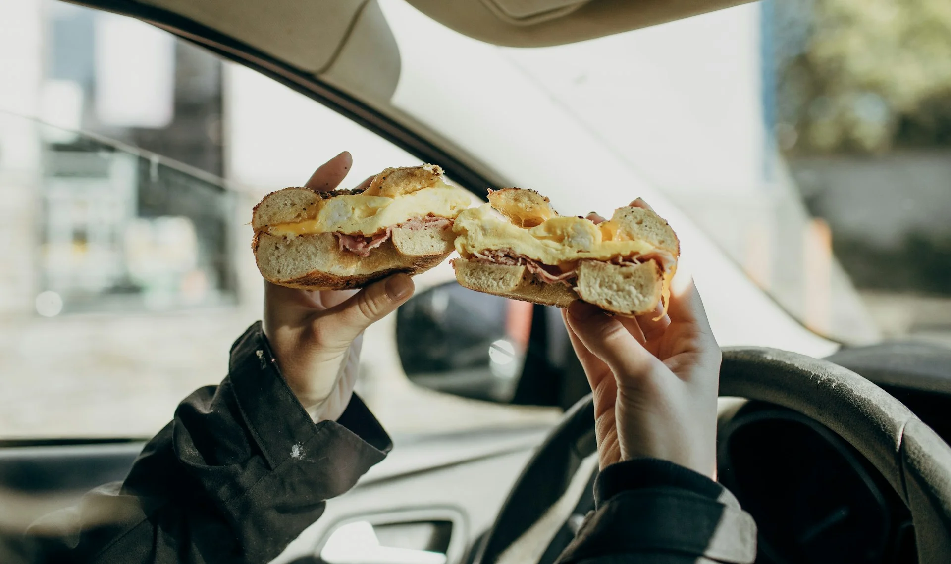 Healthy fast food breakfast sandwich in a car