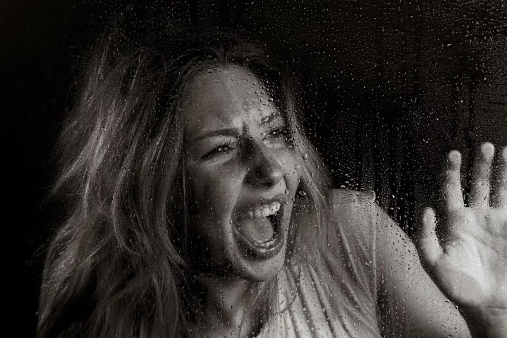 Grayscale upset woman with mouth open