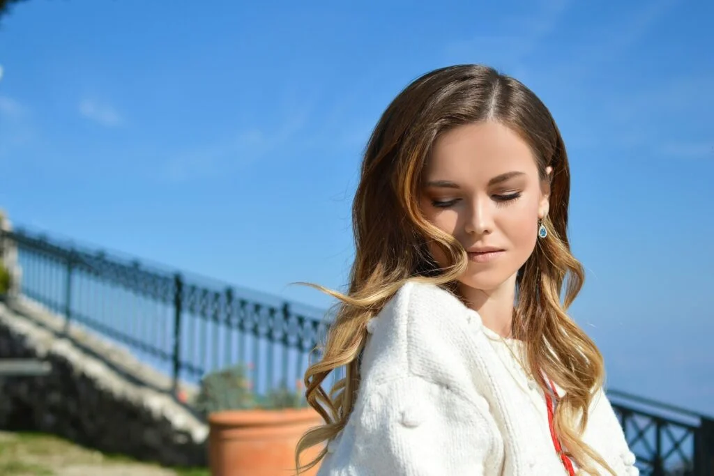 A woman with dark hair and blonde highlights