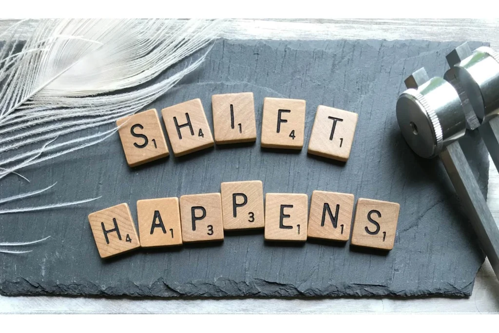 Scrabble tiles spelling out the words "Shift Happens"