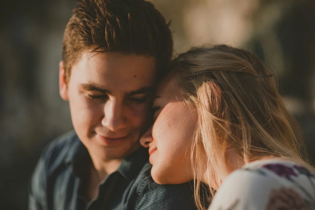 A man and woman leaning into each other