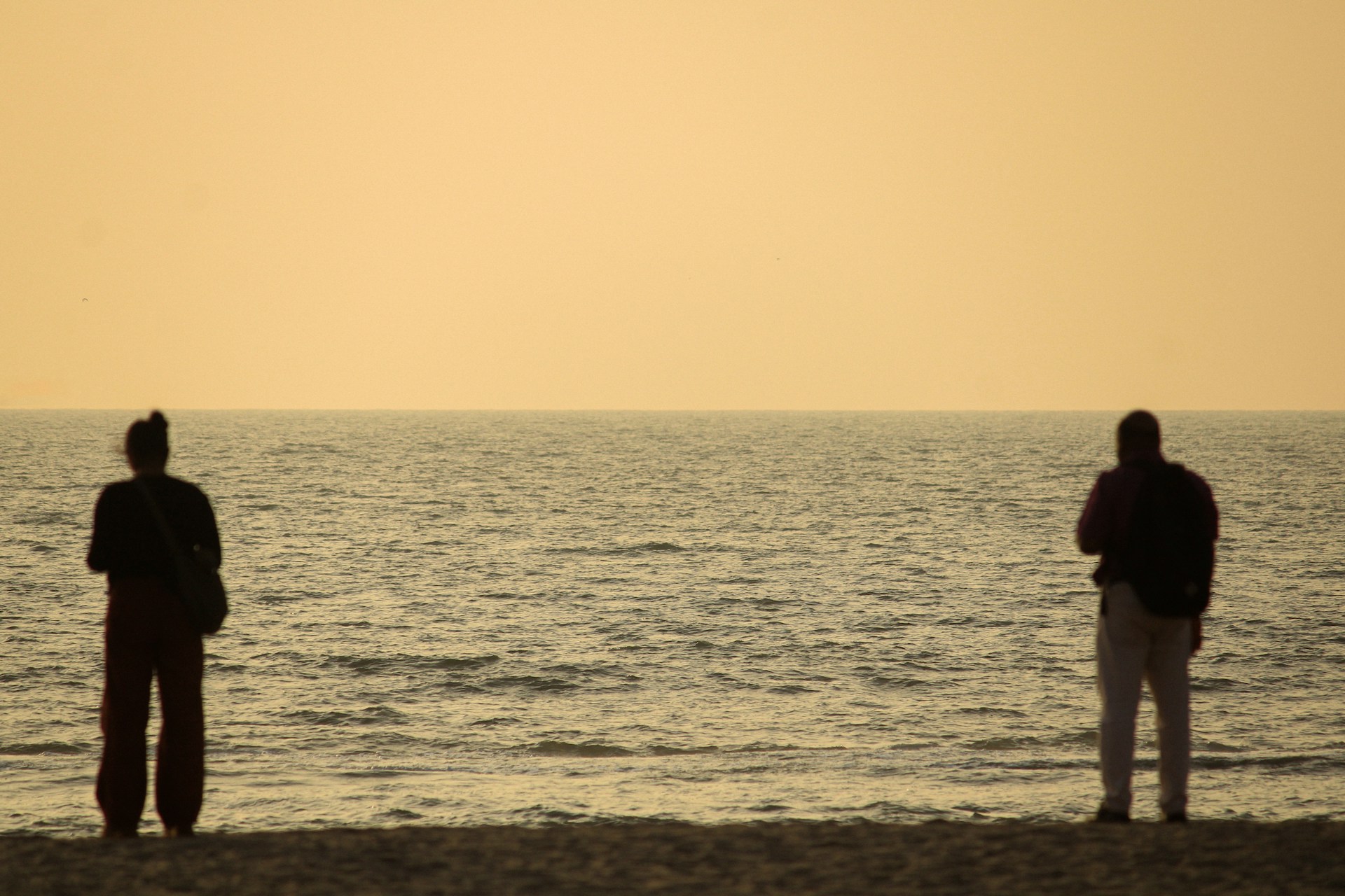 man and woman standing away from each other to express cool off meaning in relationships